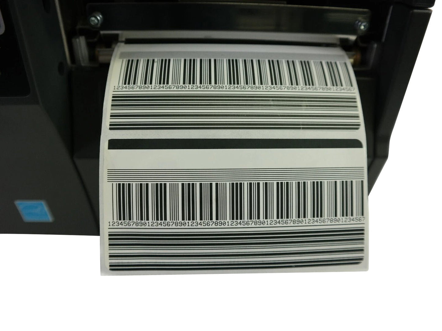 Zebra ZT230 industrial printer printing barcode label close up