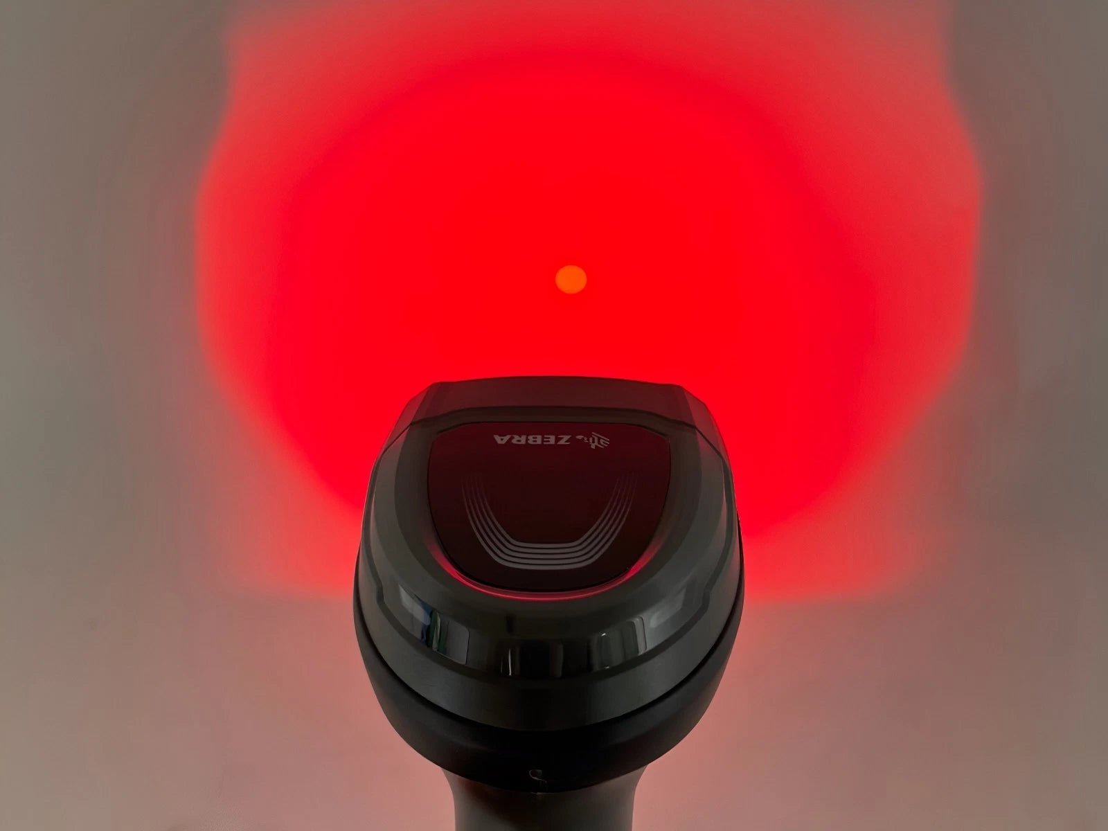 Red scanning illumination pattern projected during barcode reading